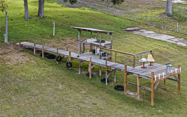 a view of a chairs and table on the deck
