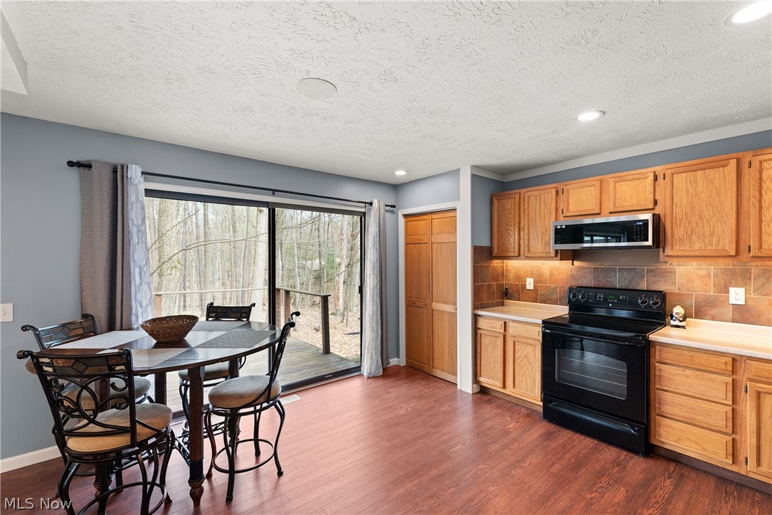 17364 Falling Water Road Strongsville, OH 44136 - Photo 15 of 36 Kitchen with Large Slider Door to the Deck