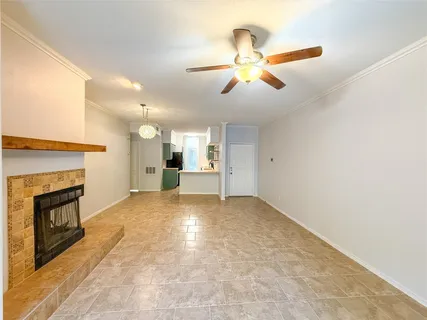 a view of an empty room with a fireplace