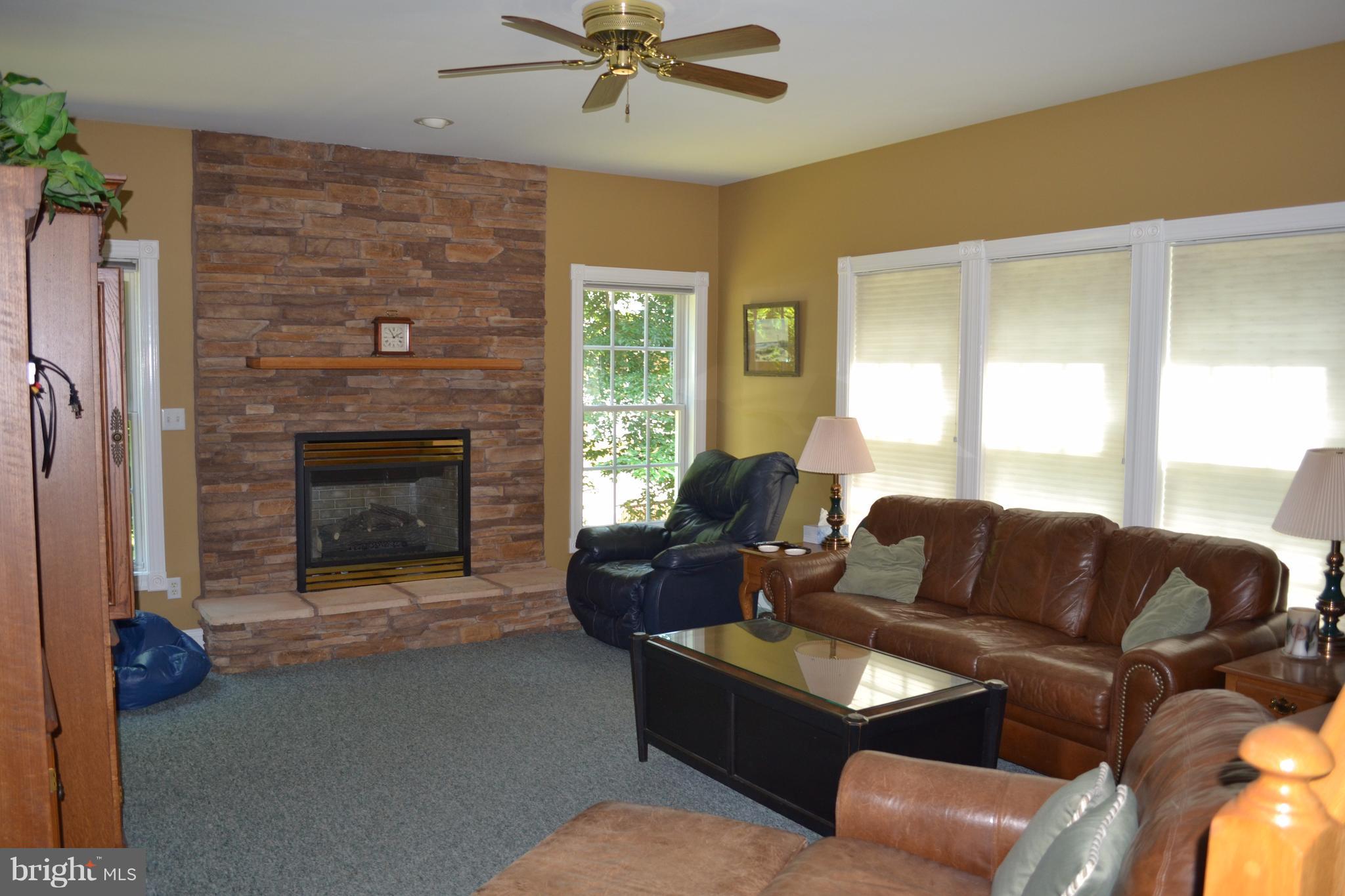 482 Copeland Road Fallston, MD 21047 - Photo 8 of 19 a living room with furniture and a fireplace