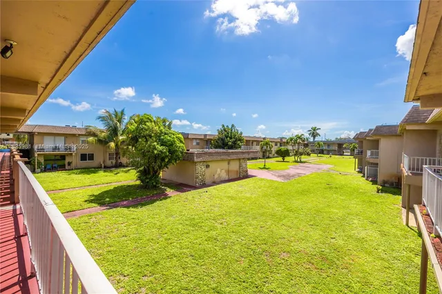 a view of a swimming pool with an outdoor space and seating area