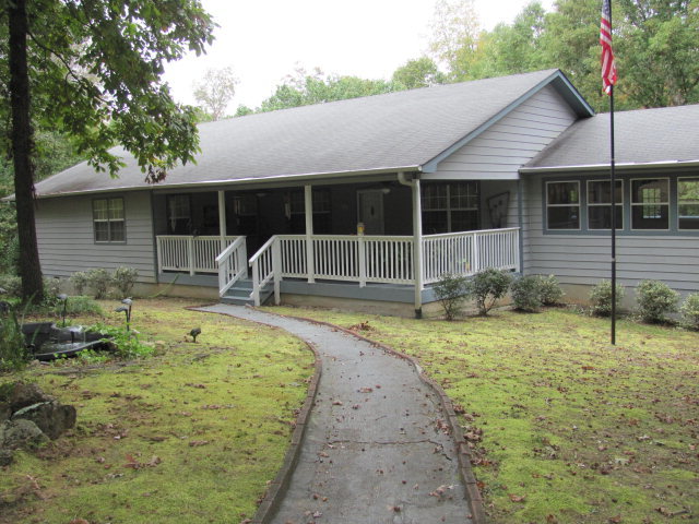 162 Ham Road, Unit 8 Jackson, GA 30233 - Photo 1 of 1 a swimming pool with outdoor seating and yard