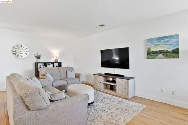 a living room with furniture and a table