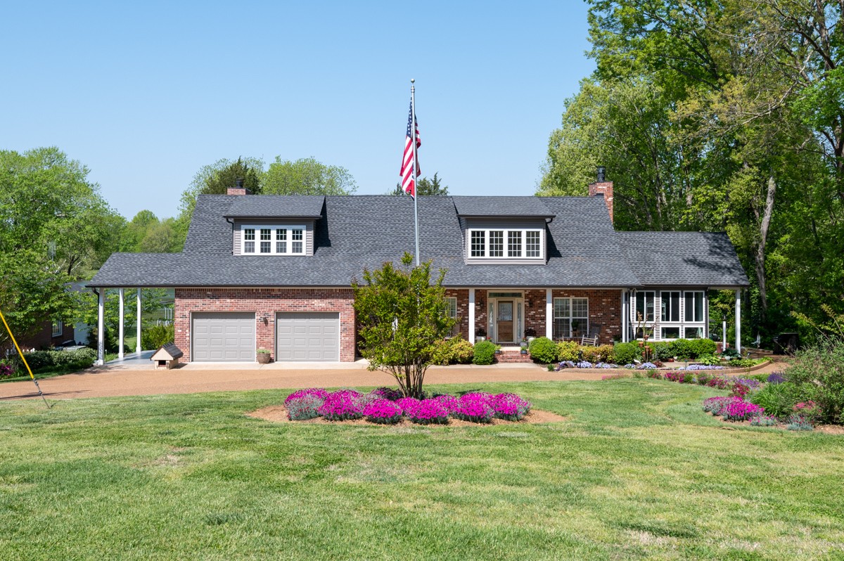 450 North Denny Road Lebanon, TN 37087 - Photo 1 of 65 a front view of a house with an outdoor space and seating