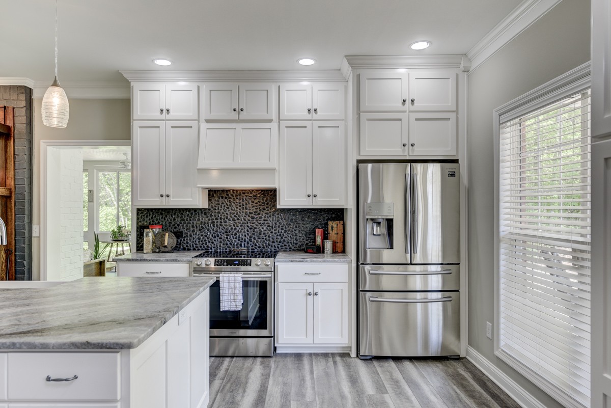 450 North Denny Road Lebanon, TN 37087 - Photo 11 of 65 a kitchen with white cabinets and stainless steel appliances