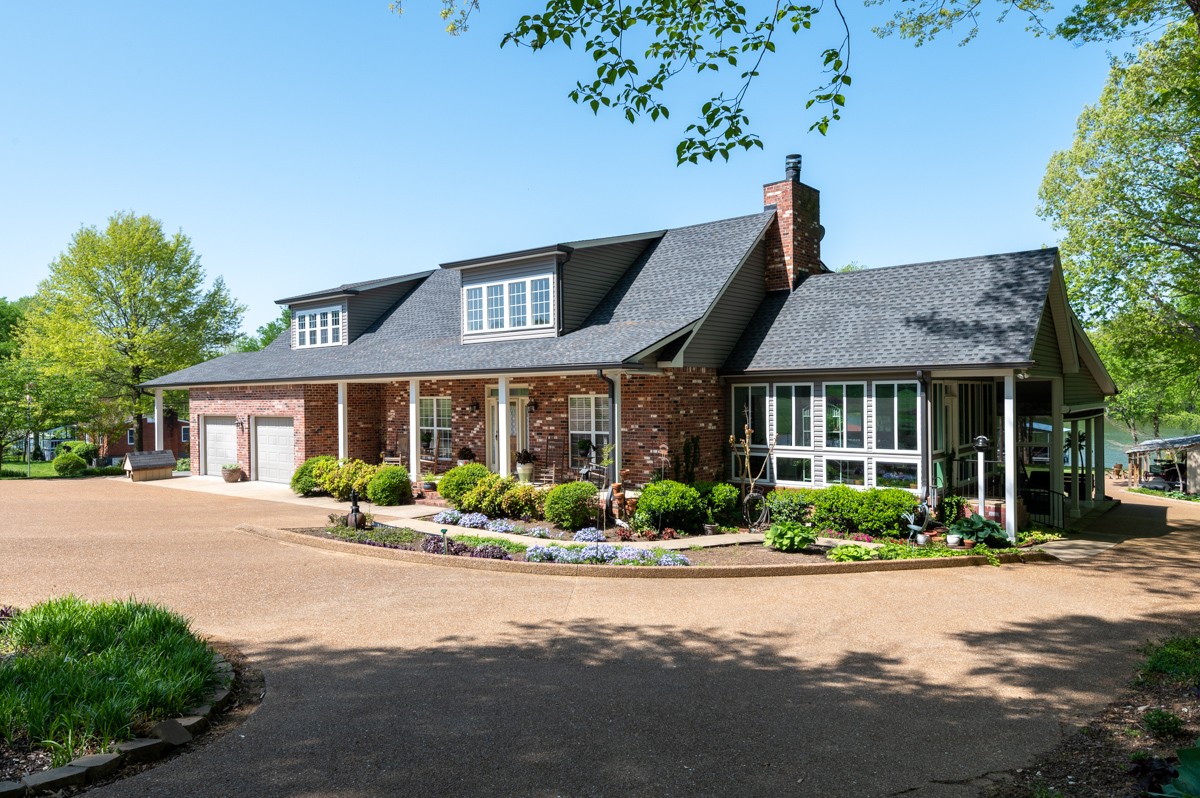 450 North Denny Road Lebanon, TN 37087 - Photo 3 of 65 a front view of a house with a yard and potted plants