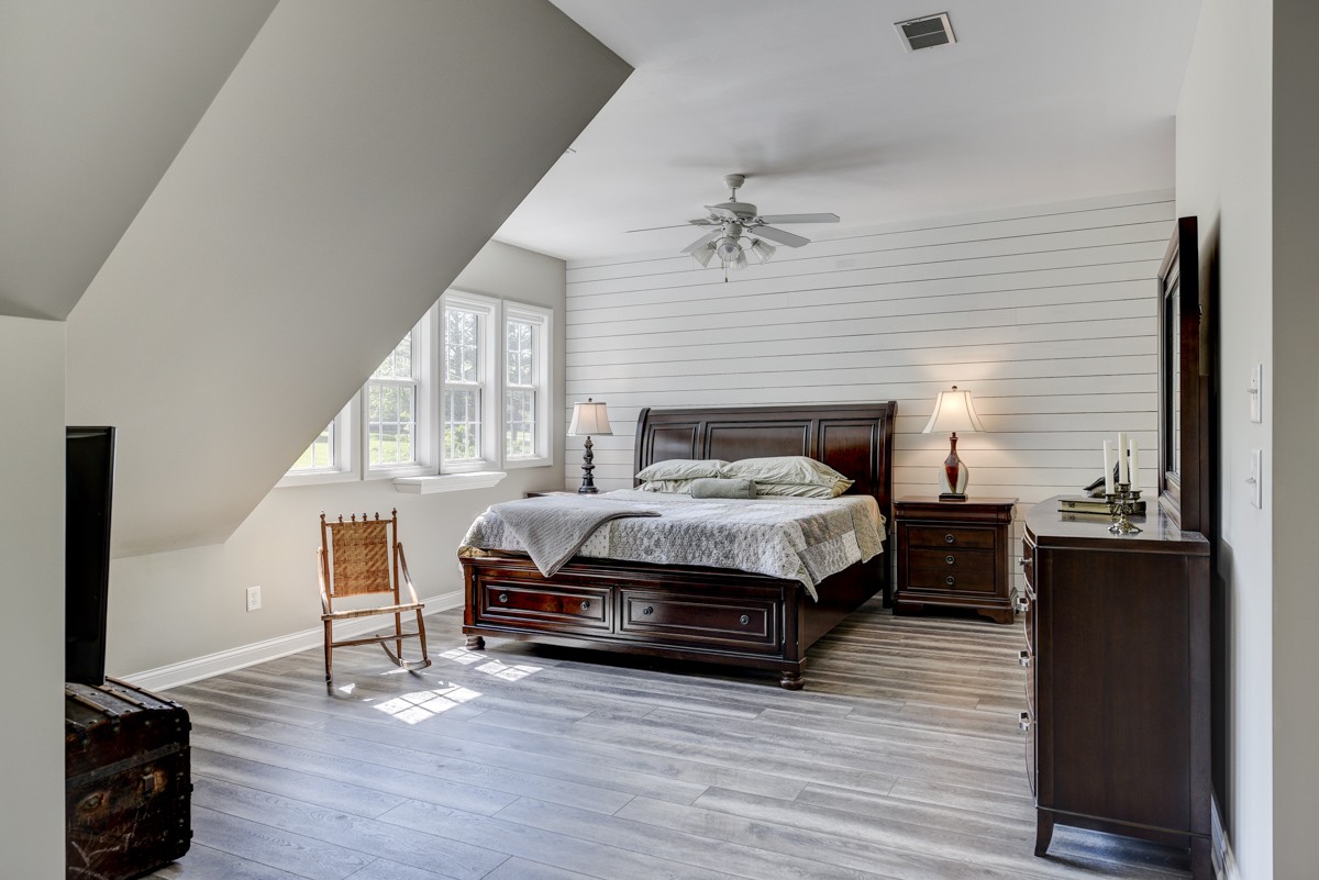 450 North Denny Road Lebanon, TN 37087 - Photo 31 of 65 a bedroom with a bed and a chandelier