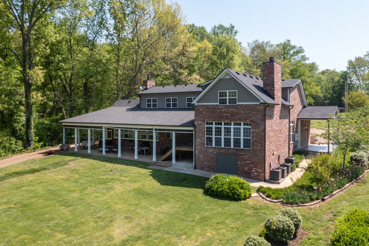 450 North Denny Road Lebanon, TN 37087 - Photo 45 of 65 a front view of a house with a yard and potted plants