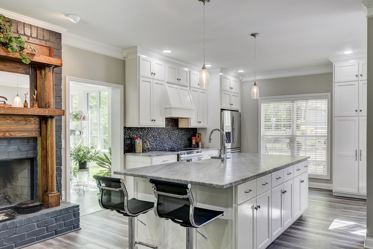 450 North Denny Road Lebanon, TN 37087 - Photo 10 of 65 a kitchen with kitchen island granite countertop a stove a sink and a refrigerator
