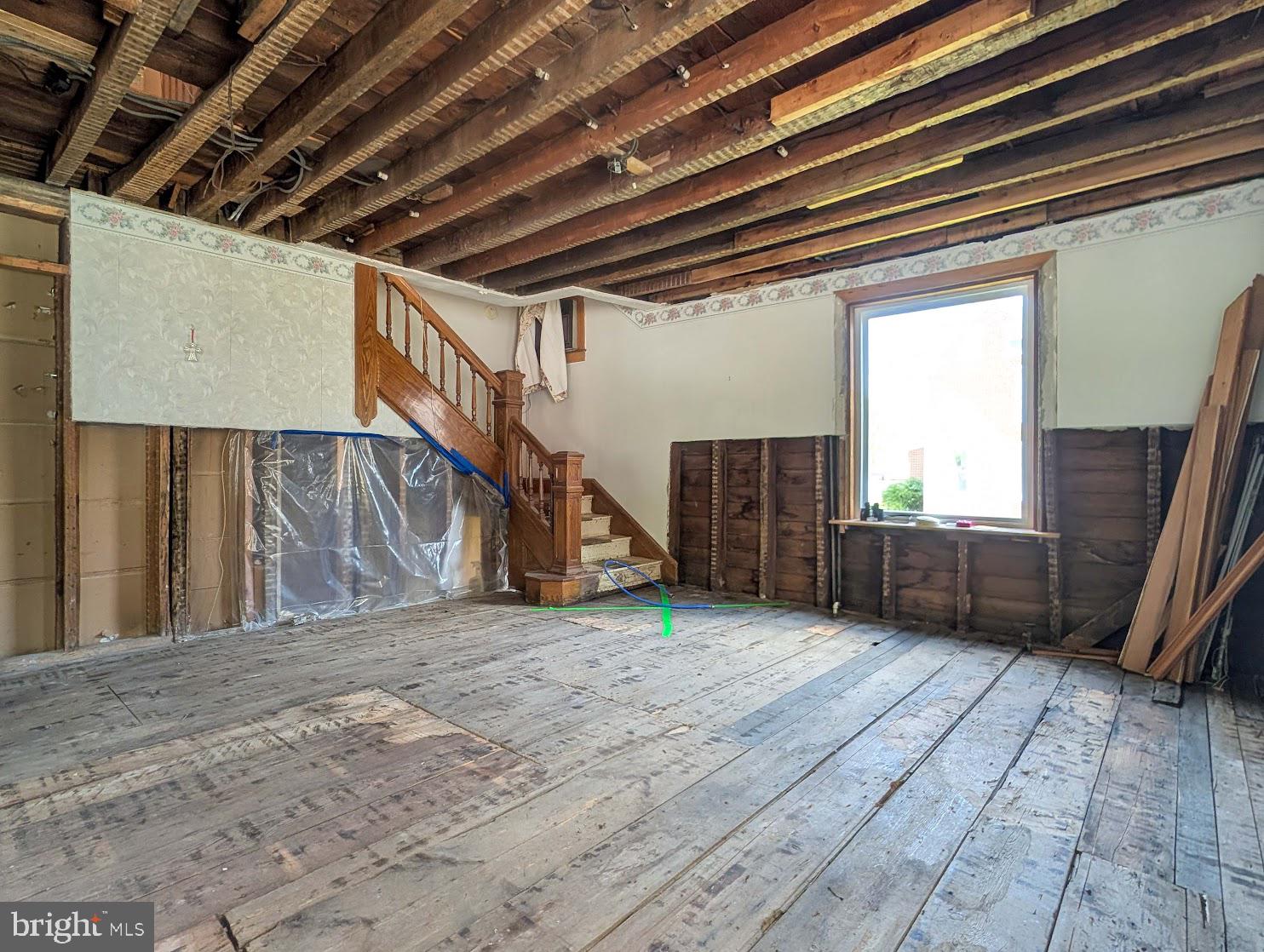 601 16th Street Saxton, PA 16678 - Photo 22 of 57 a view of an empty room with wooden floor and a window