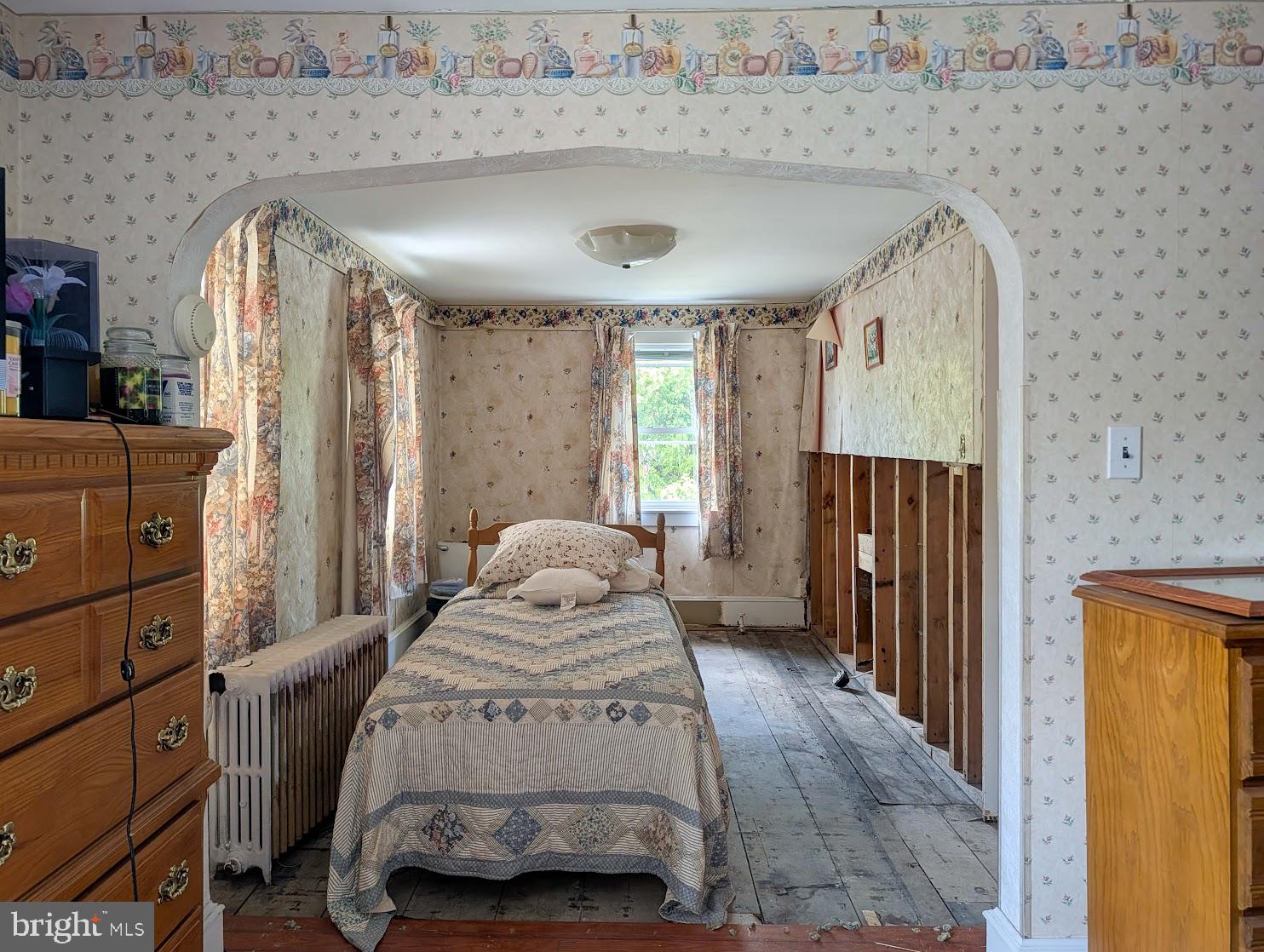 601 16th Street Saxton, PA 16678 - Photo 31 of 57 a bedroom with a bed and a mirror
