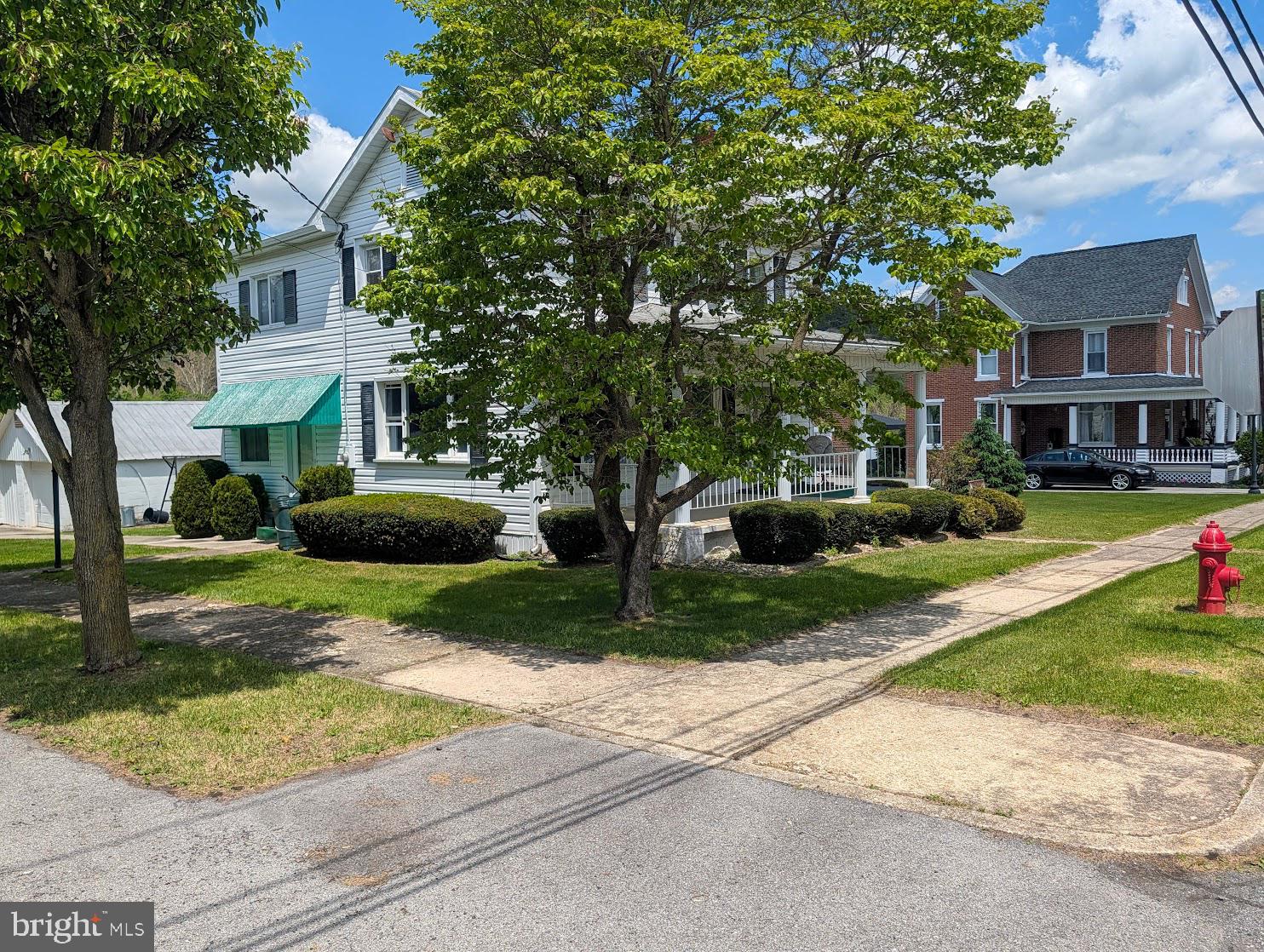 601 16th Street Saxton, PA 16678 - Photo 32 of 57 a front view of a house with a yard and a garage
