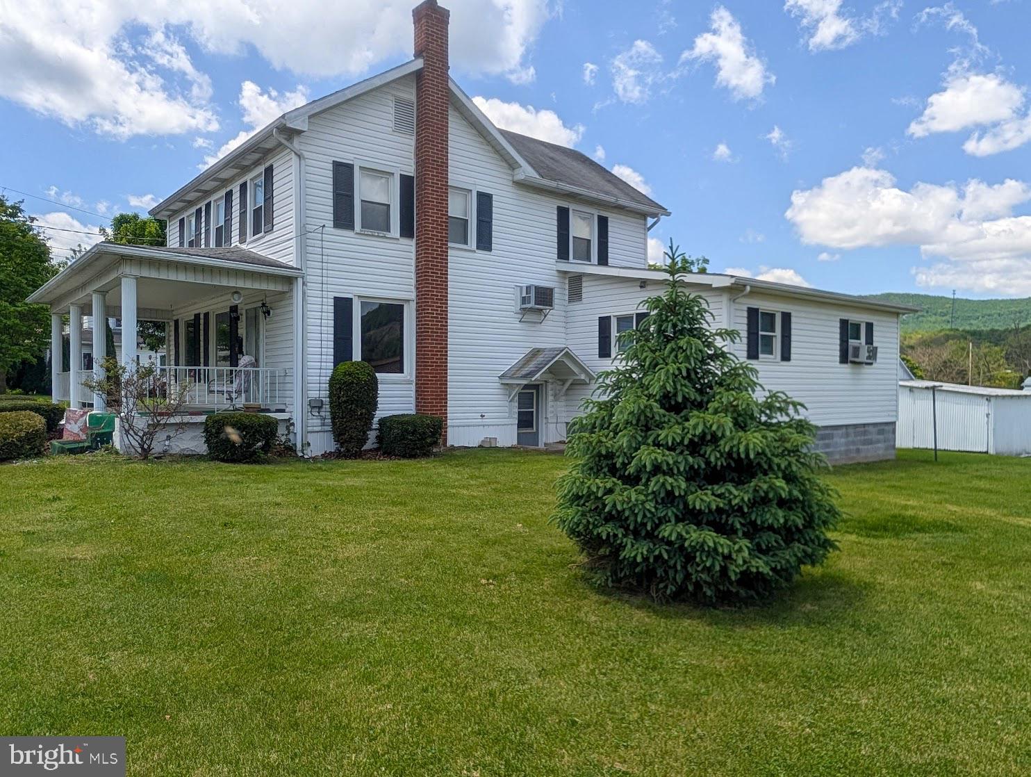 601 16th Street Saxton, PA 16678 - Photo 36 of 57 a front view of a house with a garden