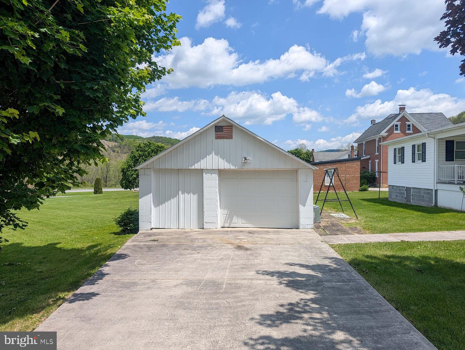 601 16th Street Saxton, PA 16678 - Photo 45 of 57 a front view of a house with a yard and garage