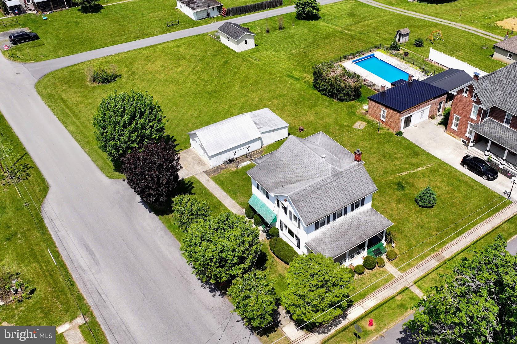 601 16th Street Saxton, PA 16678 - Photo 53 of 57 an aerial view of a house with a garden and swimming pool
