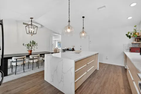 a view of kitchen and center island in the center