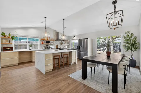 a kitchen with a table and chairs