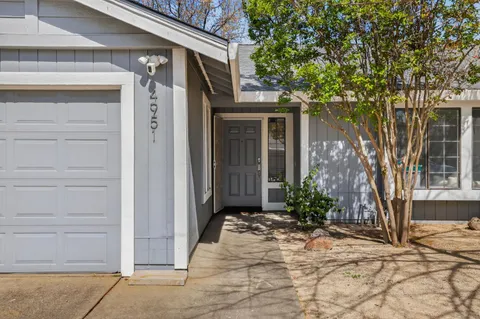a view of a house with a garden