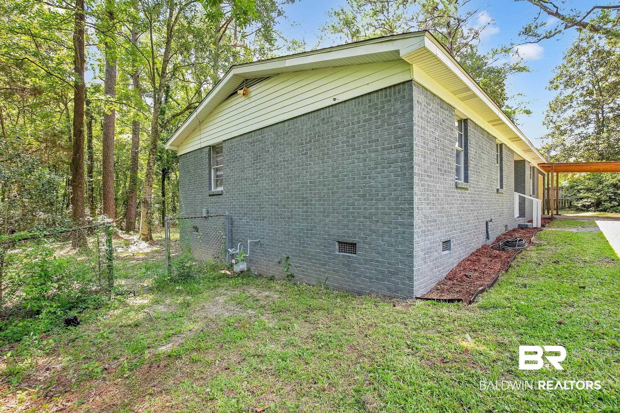 3304 Armond Drive Mobile, AL 36605 - Photo 41 of 62 View of property exterior with crawl space, brick siding, and a yard