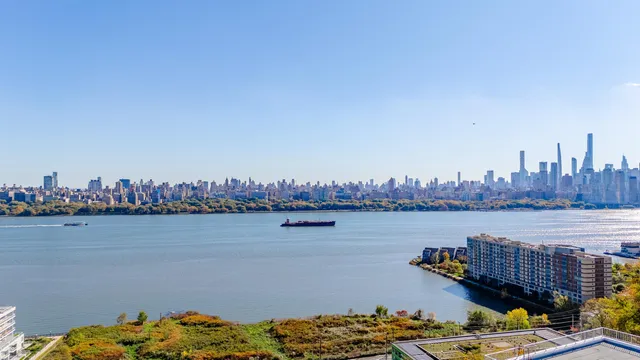 a view of a lake with a table and chairs