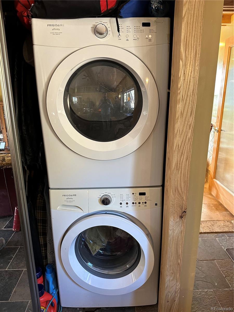 33657 Valley View Drive Evergreen, CO 80439 - Photo 11 of 13 a utility room with dryer and washer