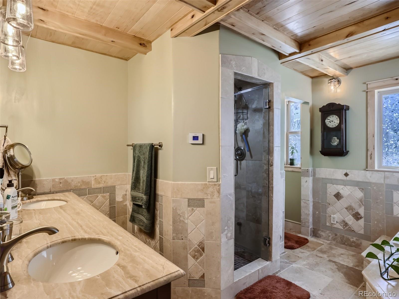 33657 Valley View Drive Evergreen, CO 80439 - Photo 5 of 13 a bathroom with a sink and a mirror