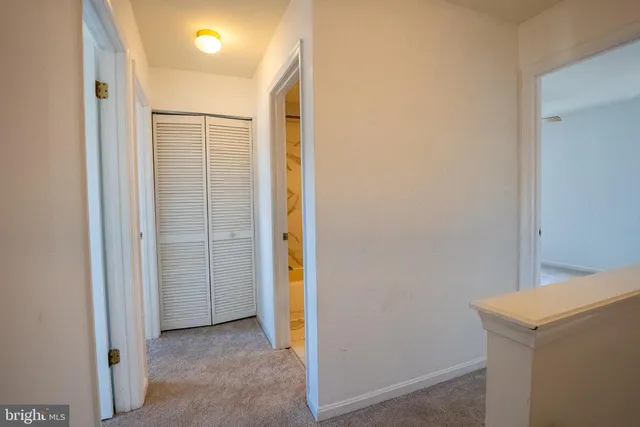 a view of an empty room with stairs