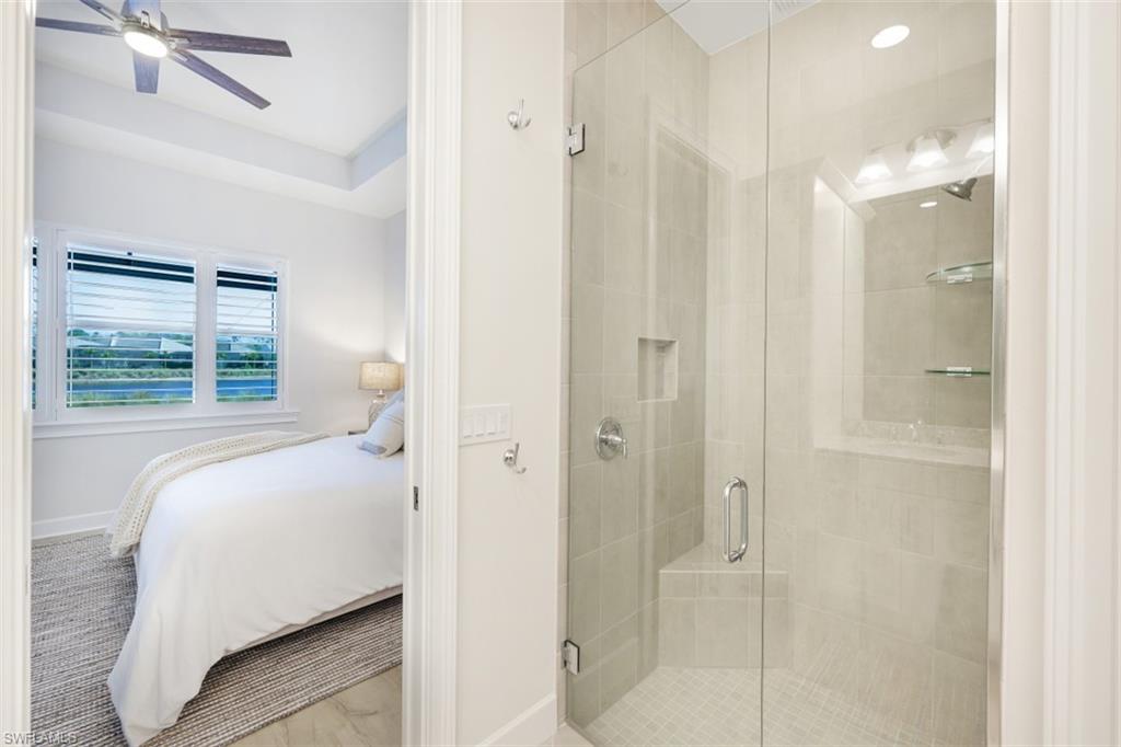 6295 Arriba Avenue Naples, FL 34113 - Photo 17 of 34 a bedroom with a bed and a window