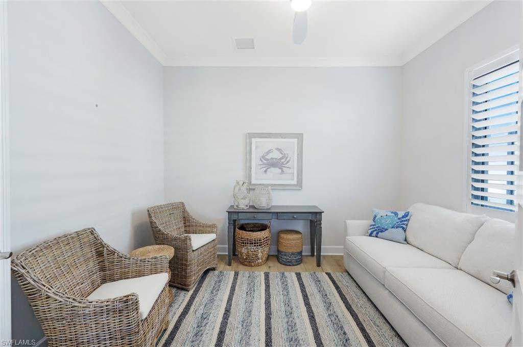 6295 Arriba Avenue Naples, FL 34113 - Photo 20 of 34 a living room with furniture and a couch