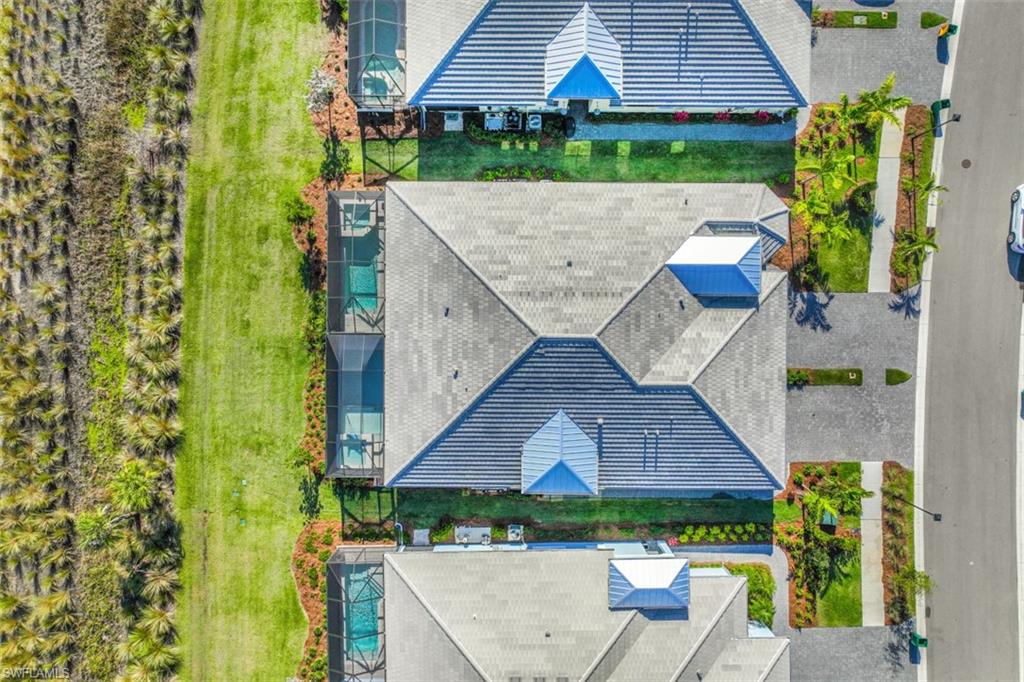 6295 Arriba Avenue Naples, FL 34113 - Photo 34 of 34 an aerial view of a house with a yard