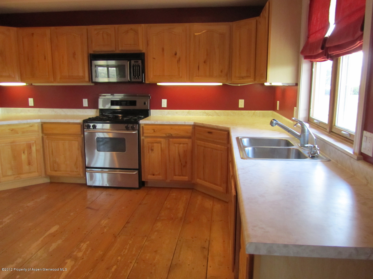 1101 County Road 227 Rifle, CO 81650 - Photo 2 of 9 a kitchen with a stove and a refrigerator