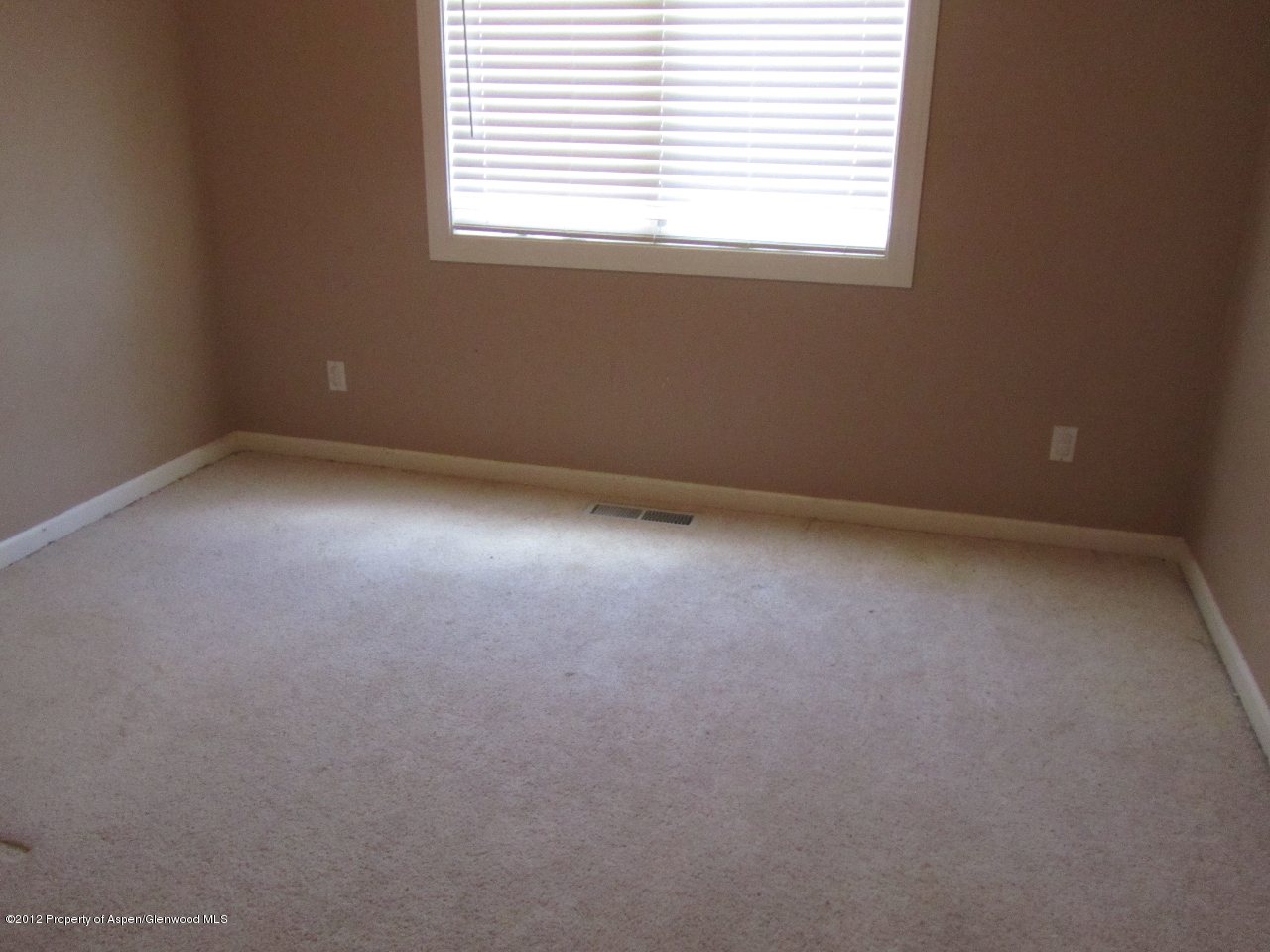 1101 County Road 227 Rifle, CO 81650 - Photo 5 of 9 an empty room with a window