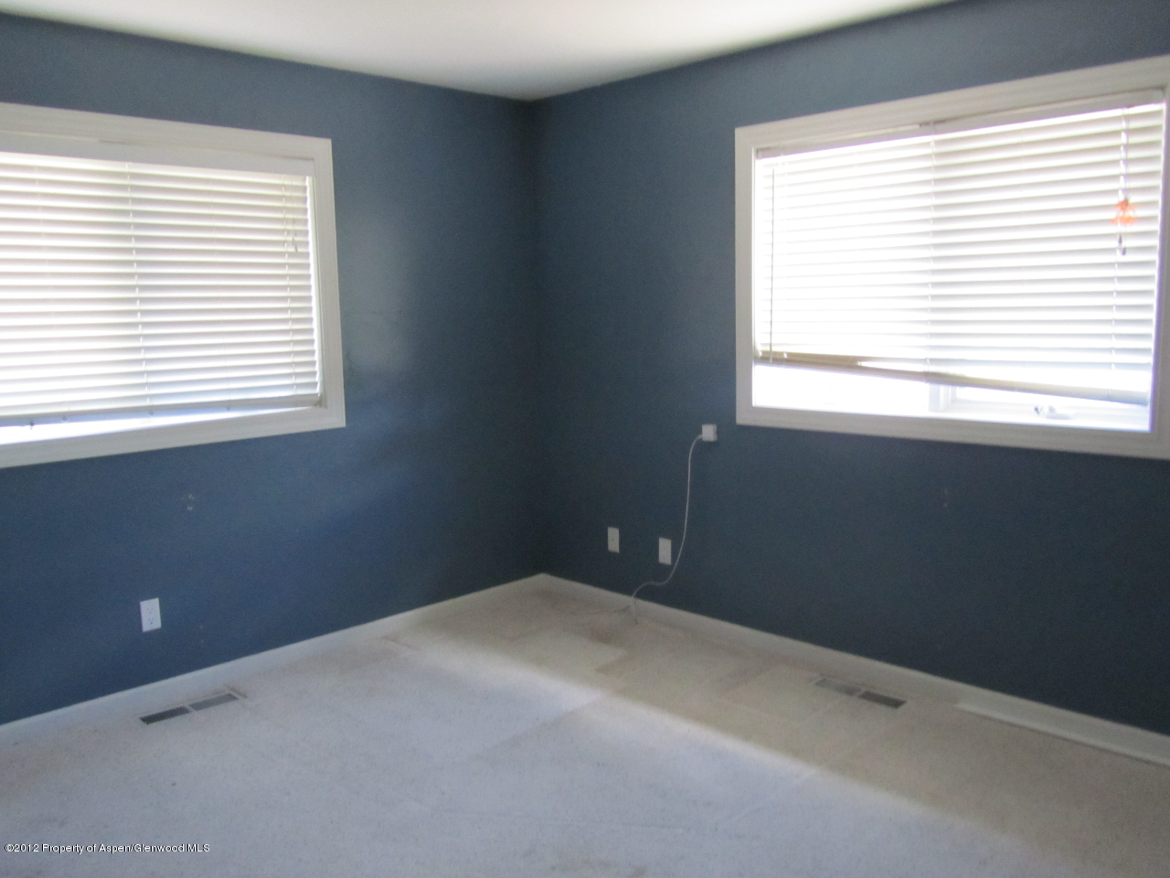 1101 County Road 227 Rifle, CO 81650 - Photo 6 of 9 a view of an empty room with a window