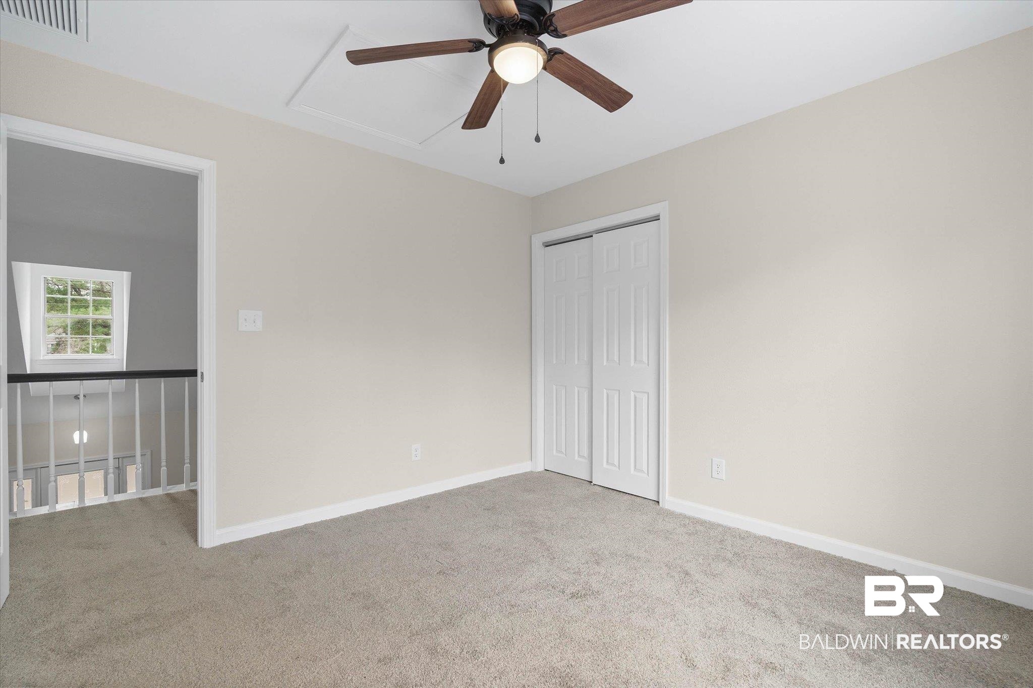 106 Melanie Loop Daphne, AL 36526 - Photo 26 of 45 Unfurnished bedroom with light carpet, a closet, and ceiling fan