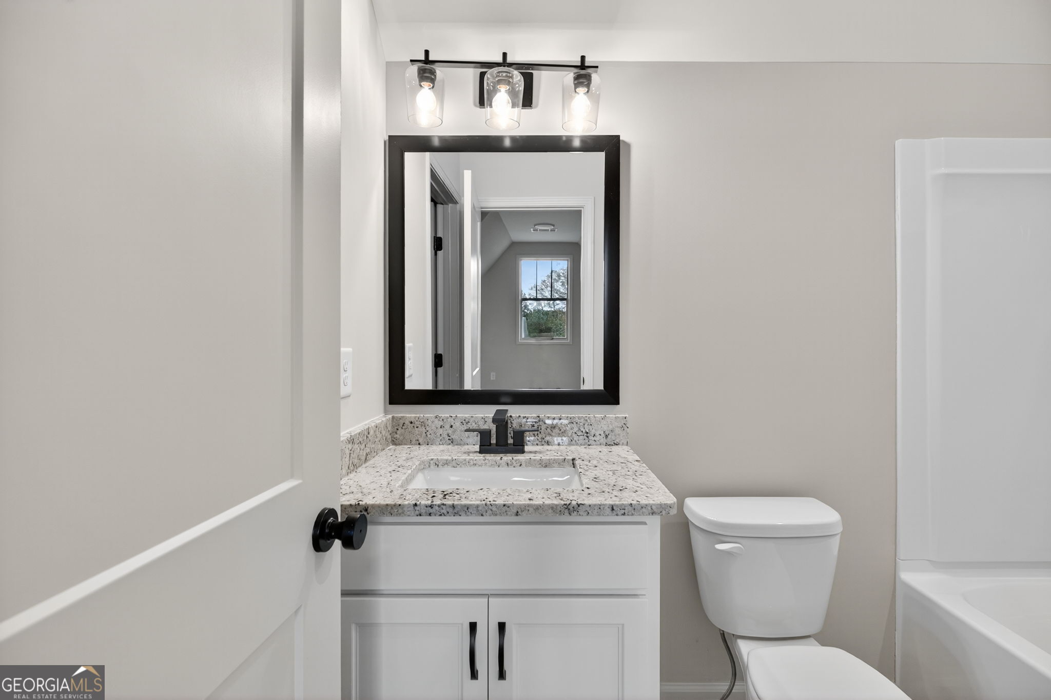 359 Gray Road Roopville, GA 30170 - Photo 41 of 46 a bathroom with a granite countertop toilet sink and mirror