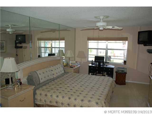 1917 Southwest Palm City Road, Unit 9I Stuart, FL 34994 - Photo 8 of 13 Master Bedroom.