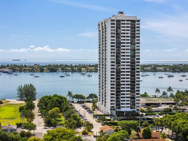 a view of a lake with tall buildings