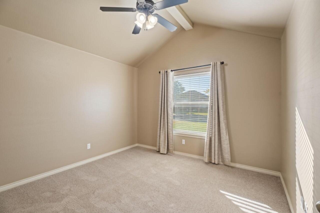 6112 101st Street Lubbock, TX 79424 - Photo 14 of 20 an empty room with windows and closet