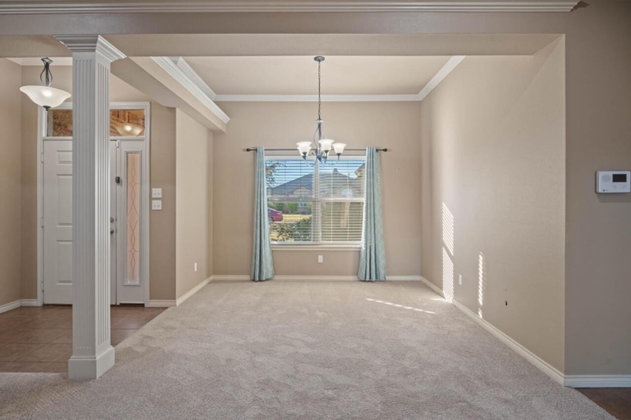 6112 101st Street Lubbock, TX 79424 - Photo 4 of 20 a view of a room with a windows and ceiling fan