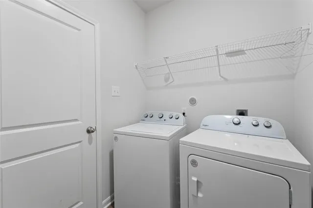 a view of storage and utility room with washer and dryer