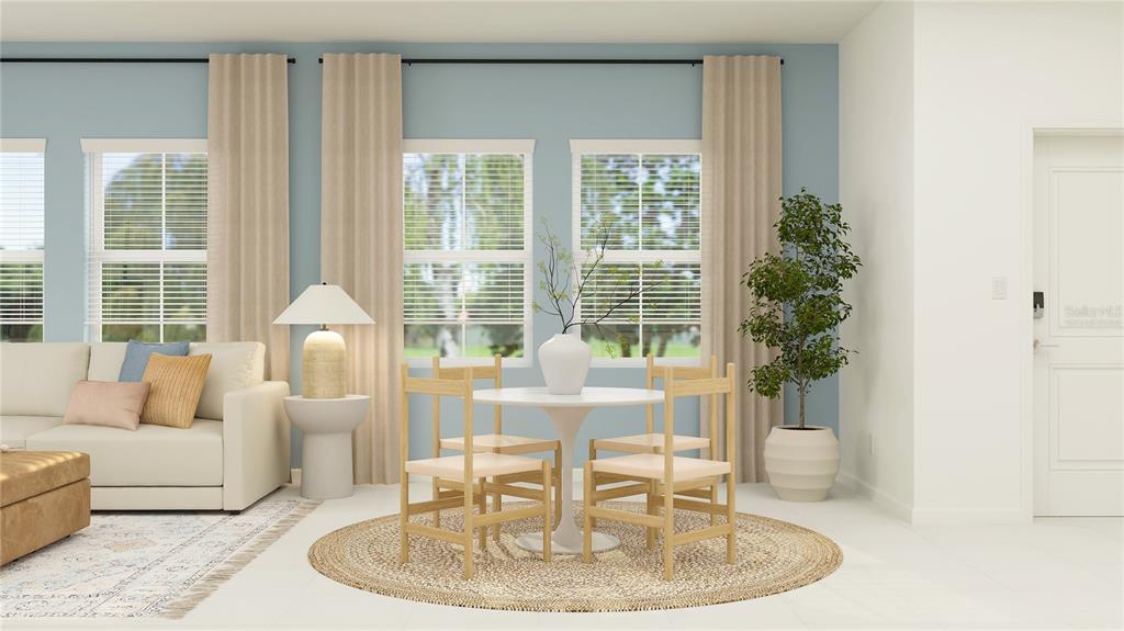 4246 St Thomas Way Kissimmee, FL 34758 - Photo 5 of 30 a living room with furniture and a potted plant