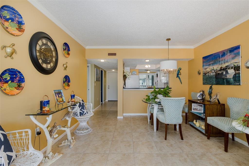 8210 Aquila Street, Unit 213 Port Richey, FL 34668 - Photo 13 of 48 a view of a dining room with furniture and a large window