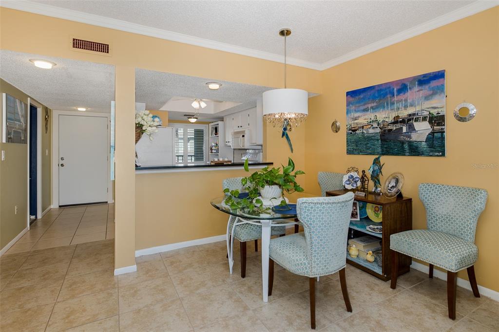8210 Aquila Street, Unit 213 Port Richey, FL 34668 - Photo 14 of 48 a view of a dining room with furniture