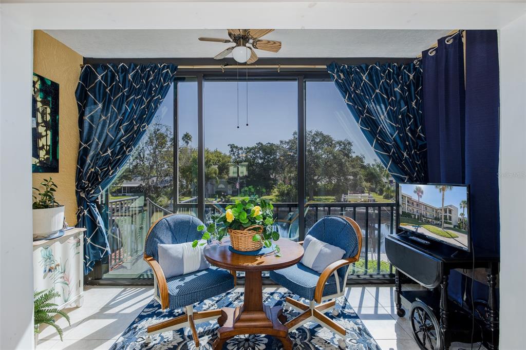 8210 Aquila Street, Unit 213 Port Richey, FL 34668 - Photo 19 of 48 a balcony view with a seating space