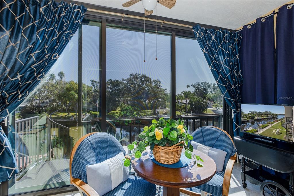 8210 Aquila Street, Unit 213 Port Richey, FL 34668 - Photo 20 of 48 a view of a porch with furniture and a potted plant