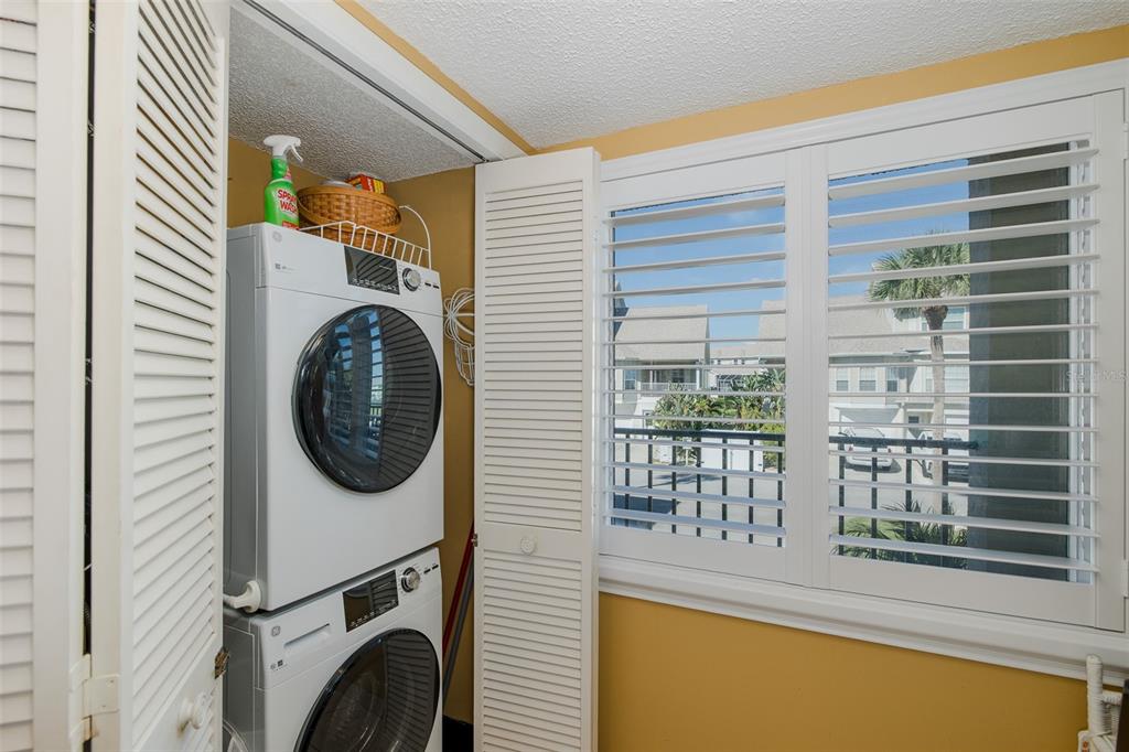 8210 Aquila Street, Unit 213 Port Richey, FL 34668 - Photo 23 of 48 a utility room with dryer and washer