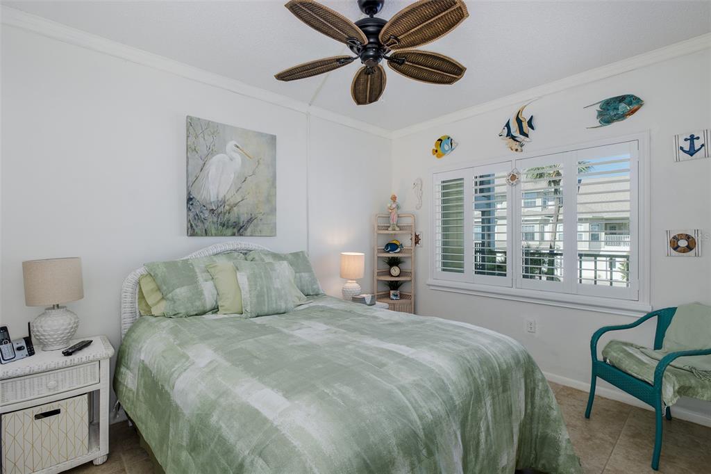 8210 Aquila Street, Unit 213 Port Richey, FL 34668 - Photo 24 of 48 a bedroom with a bed and a window