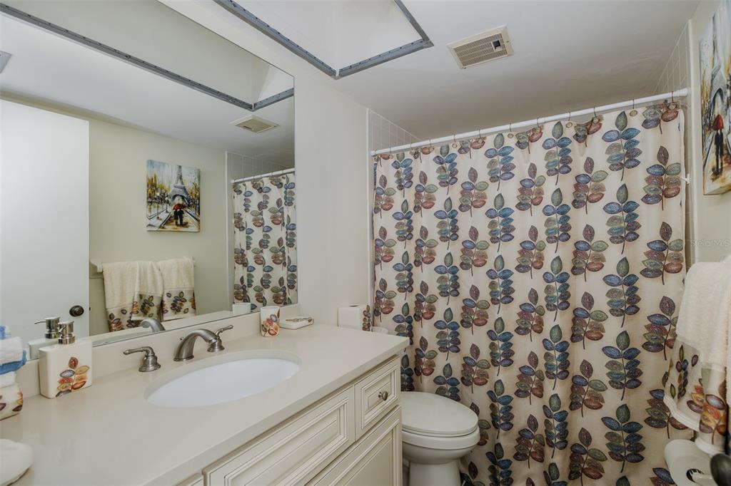 8210 Aquila Street, Unit 213 Port Richey, FL 34668 - Photo 27 of 48 a bathroom with a sink toilet and shower