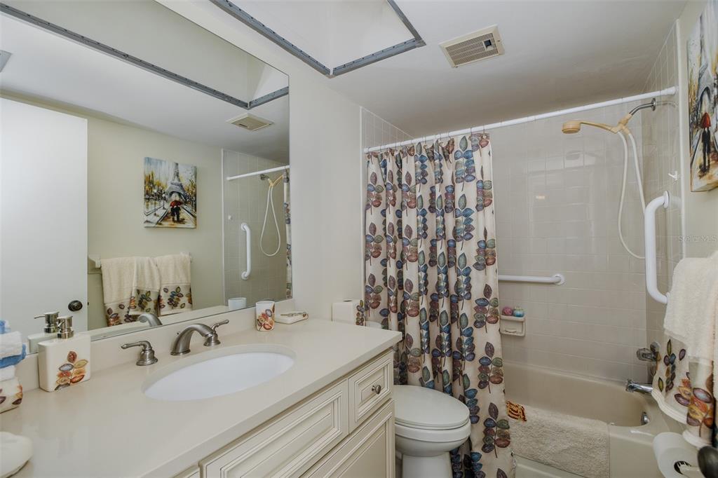 8210 Aquila Street, Unit 213 Port Richey, FL 34668 - Photo 28 of 48 a bathroom with a sink toilet and shower