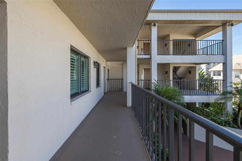 8210 Aquila Street, Unit 213 Port Richey, FL 34668 - Photo 5 of 48 a view of a house with a balcony
